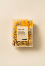 Golden Solace herbal bath bag with golden blossoms for fatigue relief